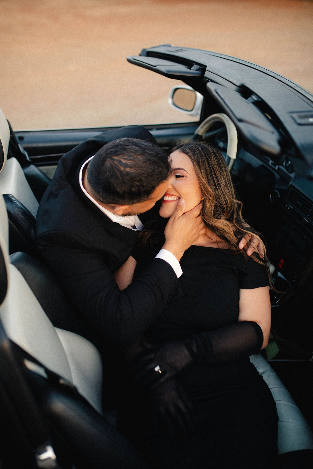 Hector and Bianca in their convertible